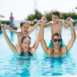 kids and parents in pool